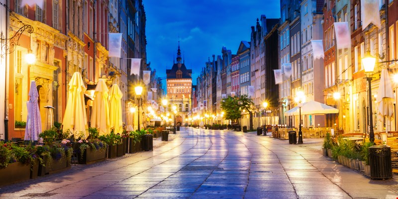 Gdansk long street at night. In the background the Gold Gate.