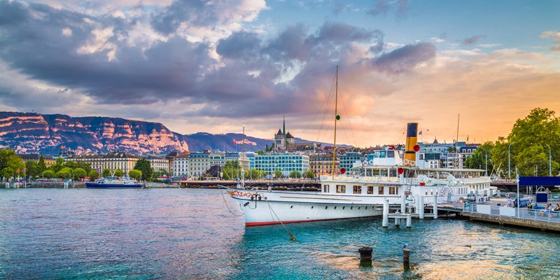 view of Montreux, Switzerland, with yellow and pink tulips standing out against the backdrop of Lake Geneva.