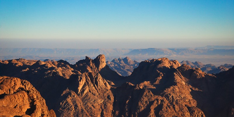 Winding road in the valley in Sinai mountains, beautiful landscape of the mountains, orange sand of Sinai. South Sinai, Sinai peninsula, Egypt