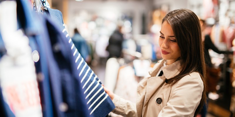 Beautiful businesswoman buying clothes