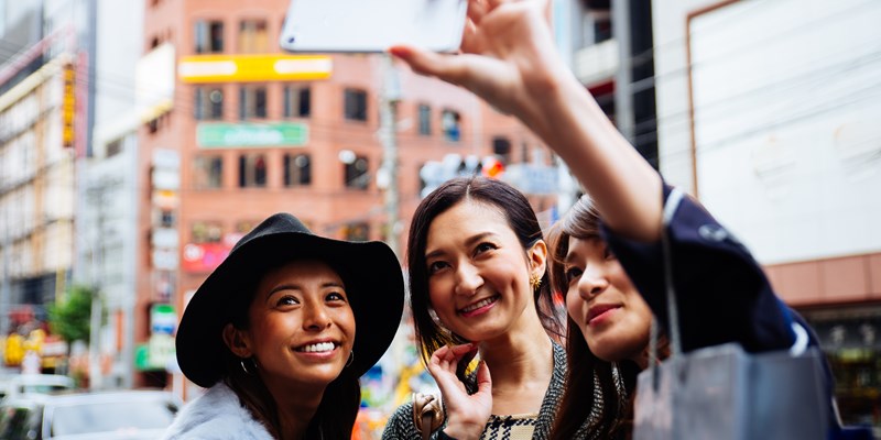 shoppers looking at a window display
